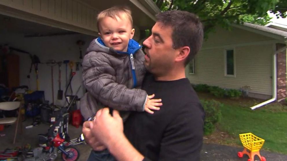 PHOTO: Avery Fitzgerald, 2, of Rockford, Ill. is seen with his father after his left eye was removed due to cancer.