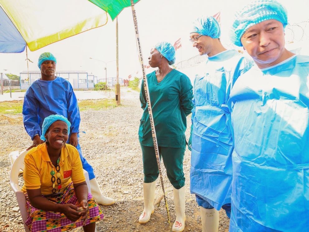 PHOTO: Beatrice Yardolo poses for a photo with staff members of the Chinese Ebola treatment unit on the day of her release in Monrovia, Liberia on March 5, 2015.