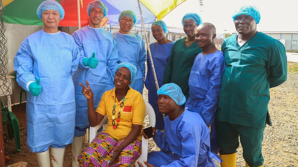 PHOTO: Beatrice Yardolo poses for a photo with members of the Ebola treatment unit on the day of her release in Monrovia, Liberia on March 5, 2015.