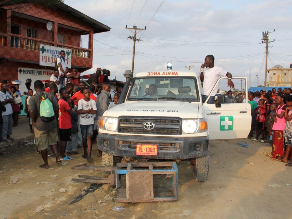 PHOTO: After a Liberian Ebola response team tried and failed to convince three potential patients to go to a treatment center with them, some angry people blocked the ambulance and insisted they would not allow the team to leave without the sick people.