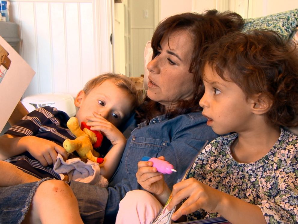 Michelle Bader is shown here with the twins she gave birth to through the help of egg donation.