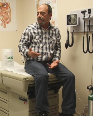 Mike Taylor, a former coal truck driver, (right), is seen here during an appointment with Dr. Van Breeding (left) at Mountain Comprehensive Health Corporation in Whitesburg, Kentucky. 