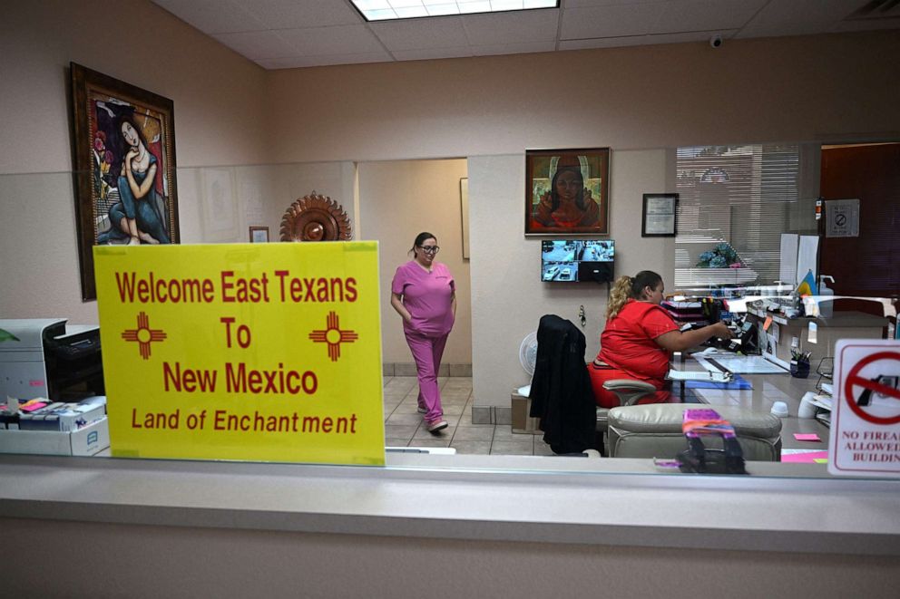 PHOTO: A sign welcoming patients from East Texas is displayed in the waiting area of ​​the Women's Reproductive Clinic, which provides legal medication abortion services, in Santa Teresa, NM, on June 15, 2022.