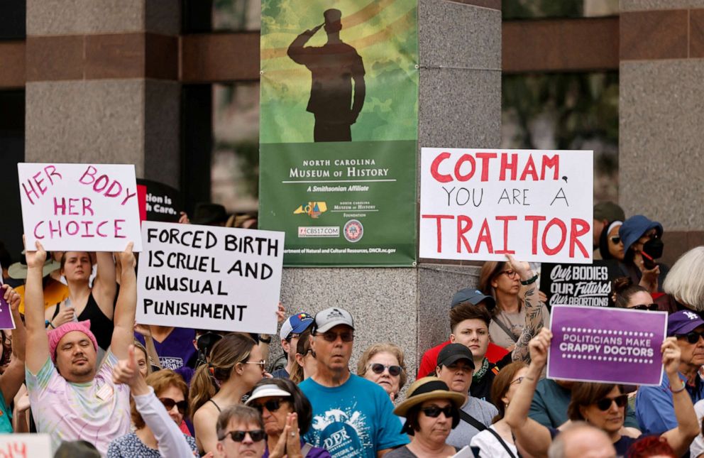 PHOTO: Protesters gather to witness Governor Roy Cooper veto the SB20 legislation, May 13, 2023, in Raleigh, N.C.