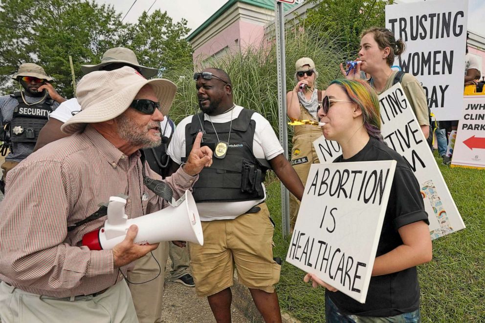 PHOTO: Abortion rights supporters use noisemakers to drown out the sound of an anti-abortion activists' bullhorn, outside the Jackson Women's Health Organization clinic in Jackson, Miss., July 6, 2022. 