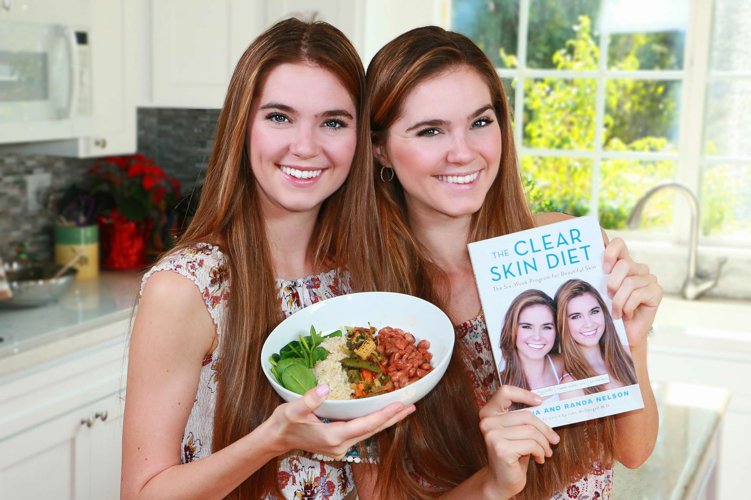 PHOTO: Randa Nelson, left, and Nina Nelson, both 24, pose with their new book, "The Clear Skin Diet."