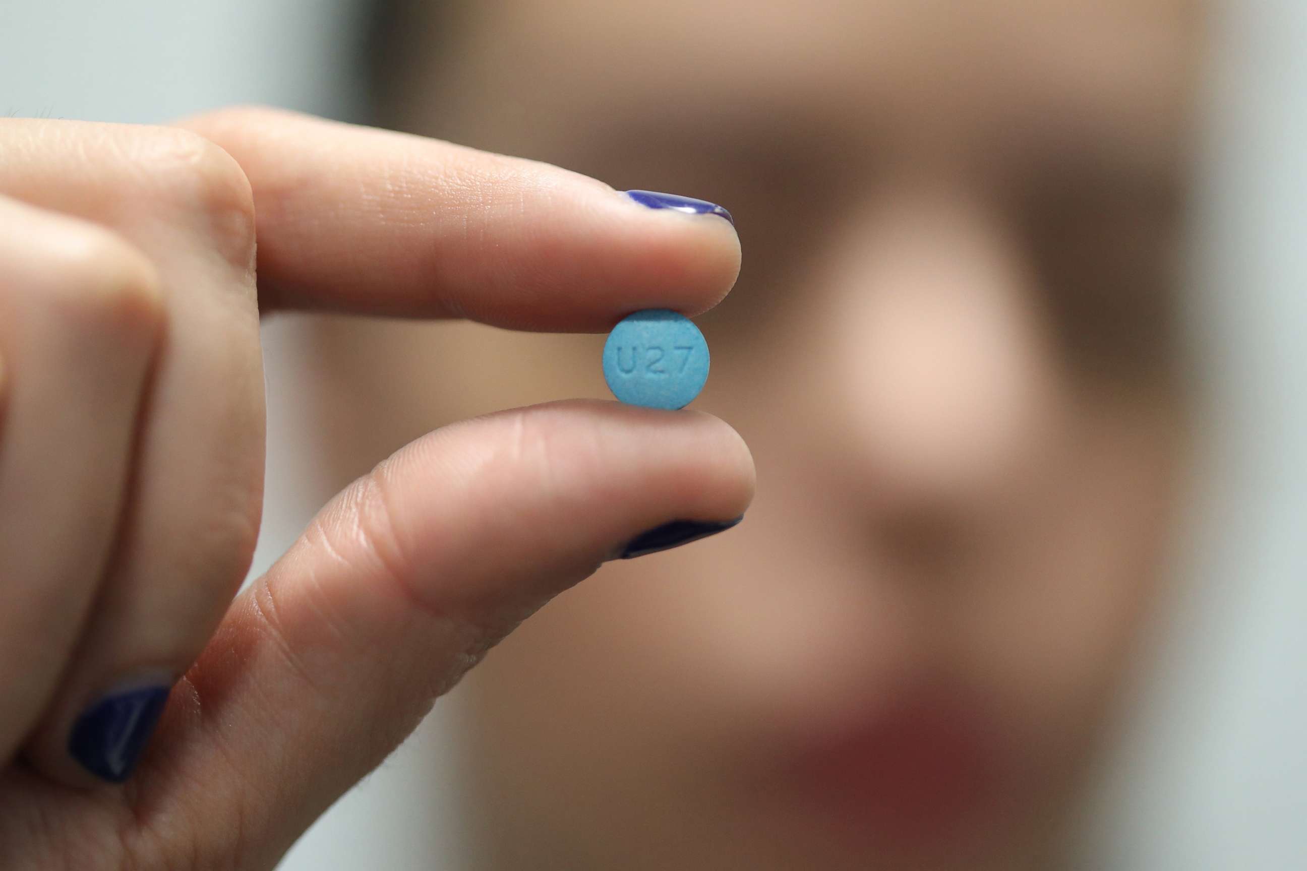 PHOTO: A person holds an Adderall pill in Puerto Rico, July 5, 2017.