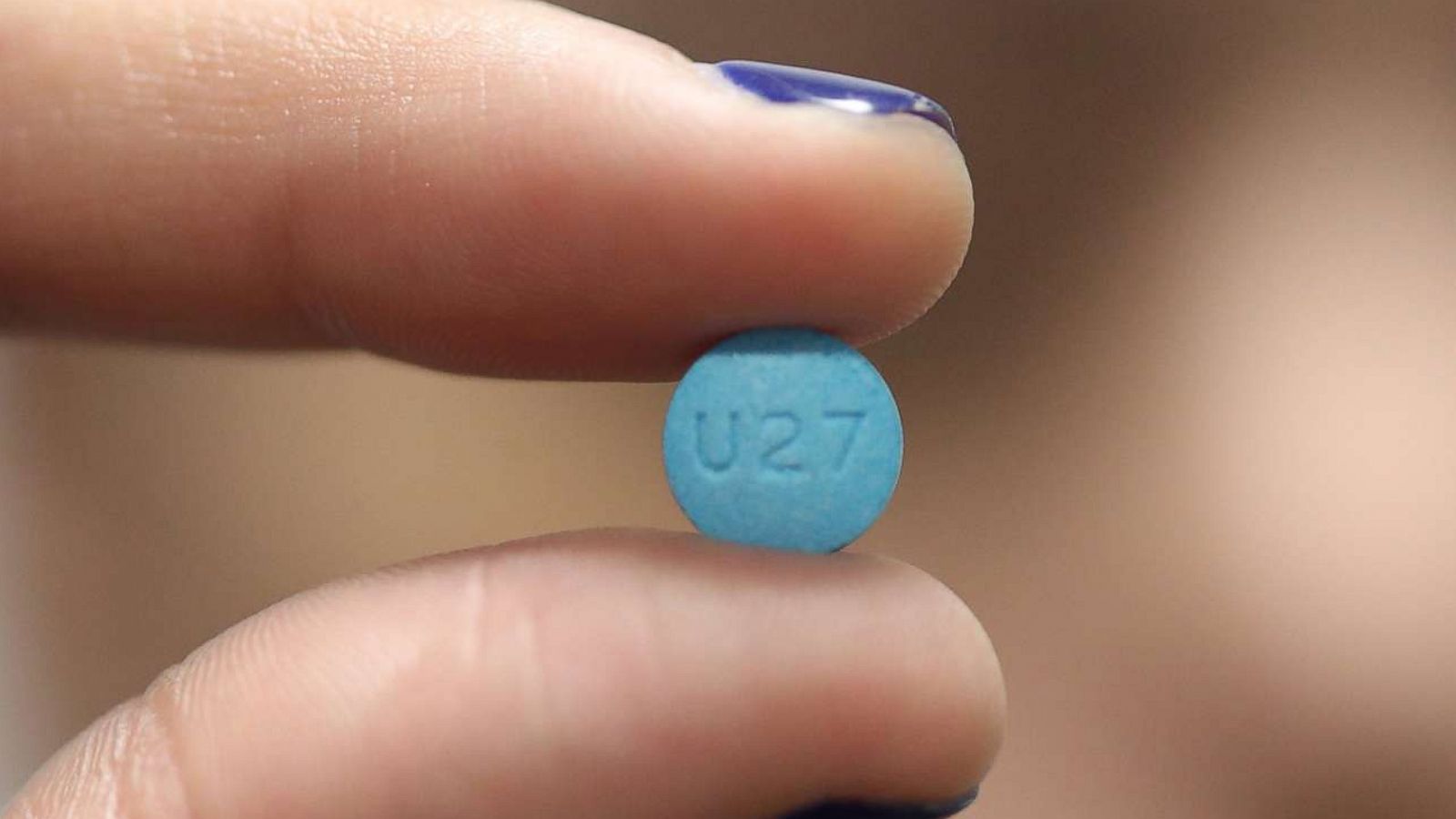 PHOTO: A person holds an Adderall pill in Puerto Rico, July 5, 2017.