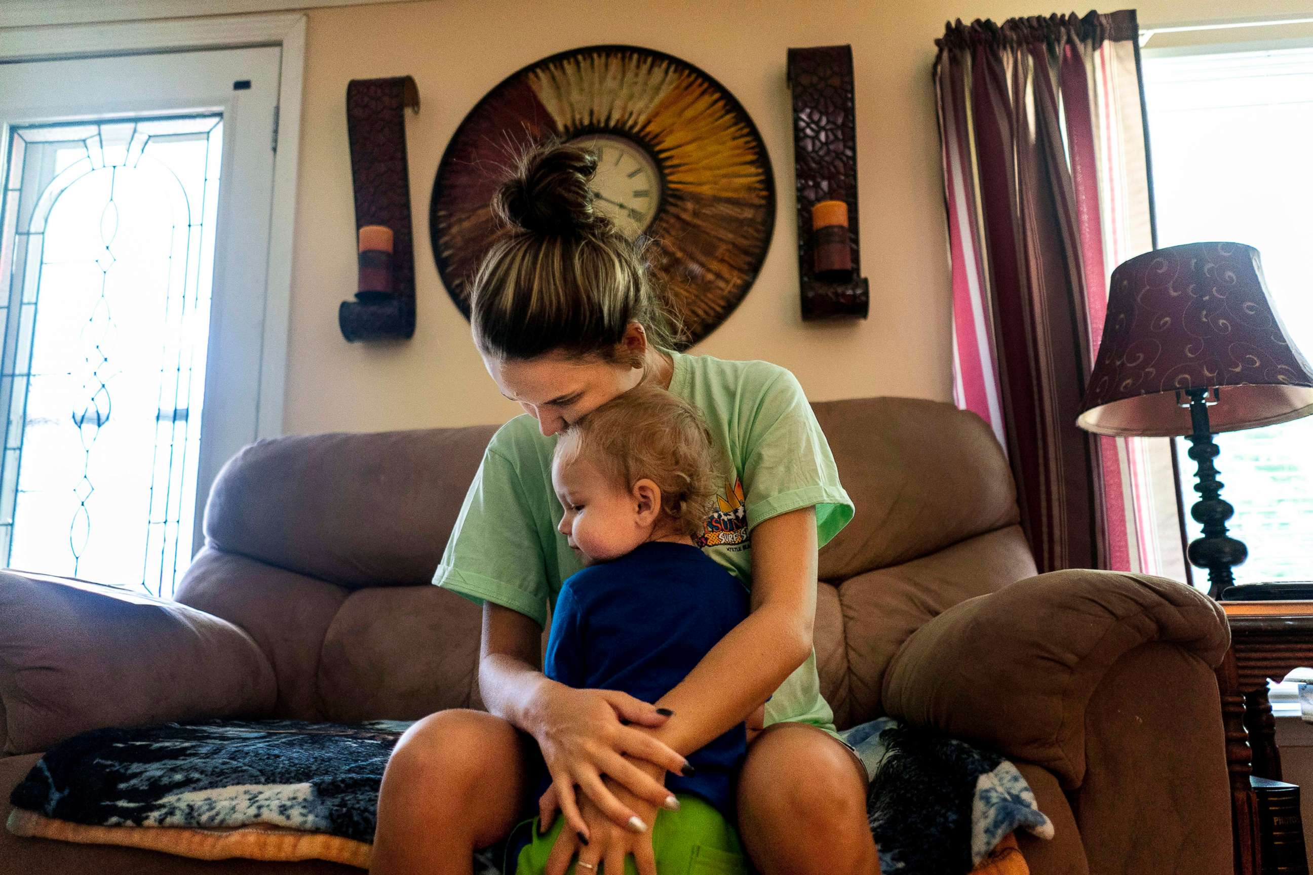 PHOTO: A mother recovering from an opioid addiction holds her son at their home in a remote area where prescription opioids addiction has greatly affected communities like Big Stone Gap, Va., July 22, 2019.