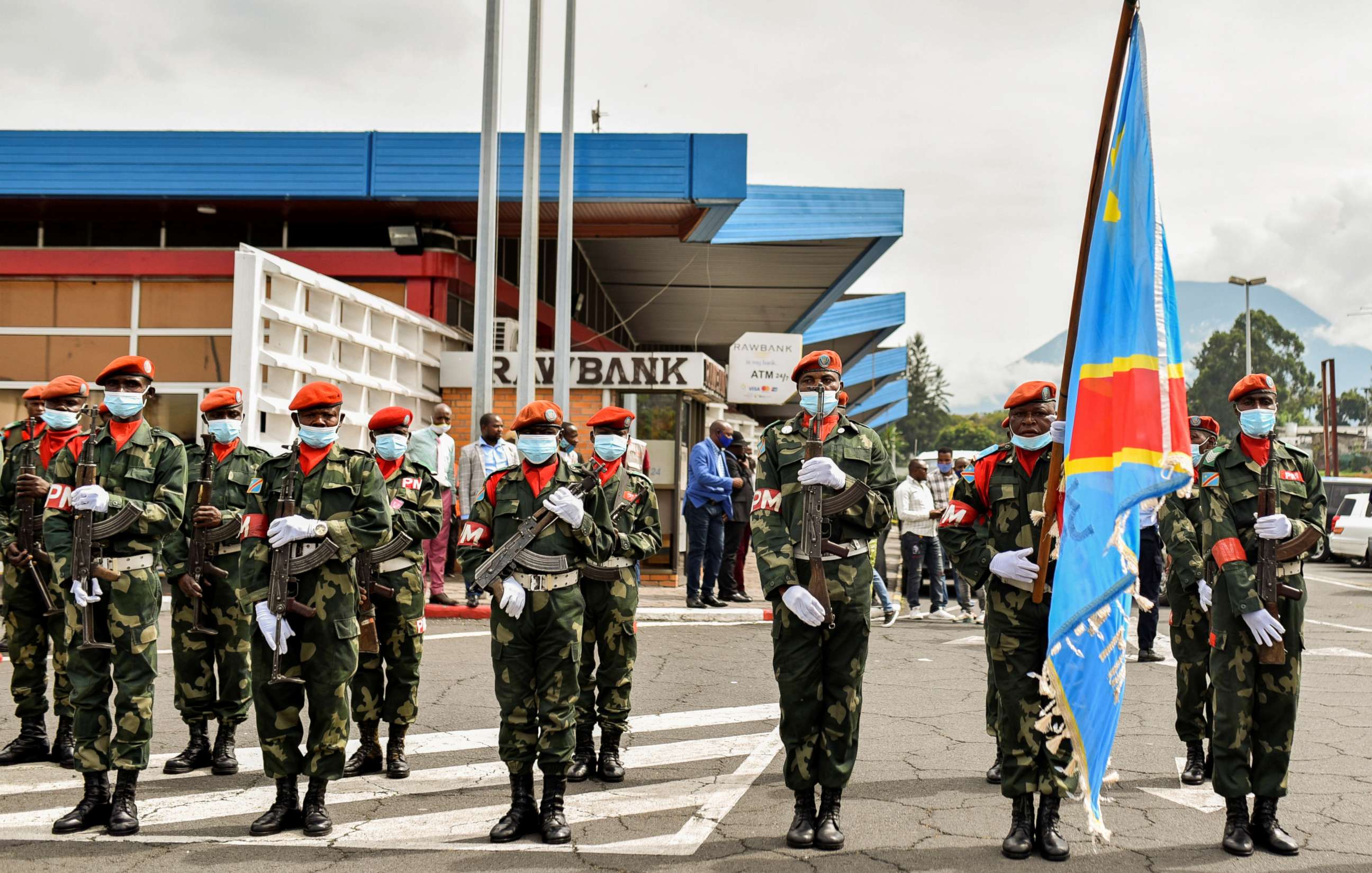 PHOTO: Congolese soldiers carry their national flag during parade at Goma airport as the new military governor arrives to take charge in Goma, North Kivu province, in the Democratic Republic of Congo, May 10, 2021.