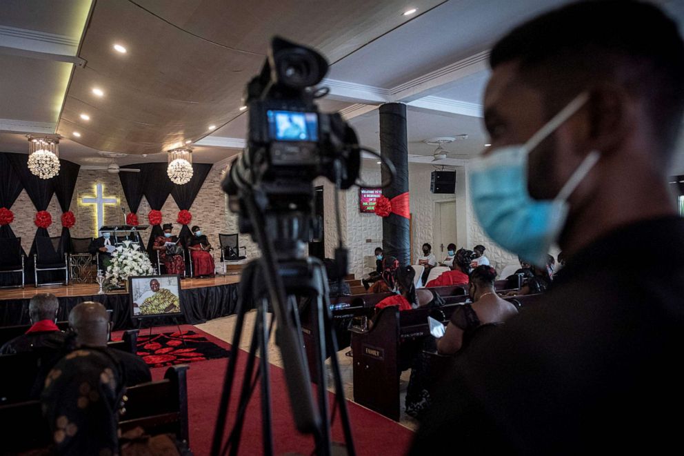 PHOTO: A cameraman films a funeral in Accra on April 22, 2021.