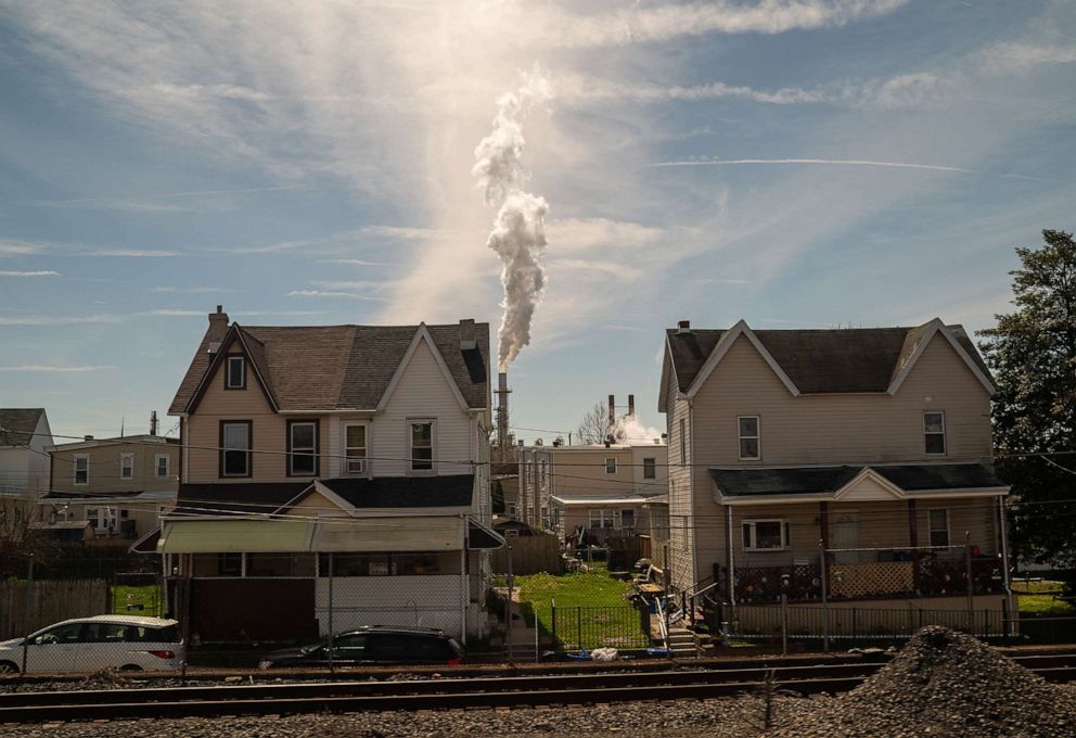PHOTO: A plume of chemical smoke rises above residential buildings from the Delaware City Refinery, on April 11, 2022, in New Castle, Delaware.