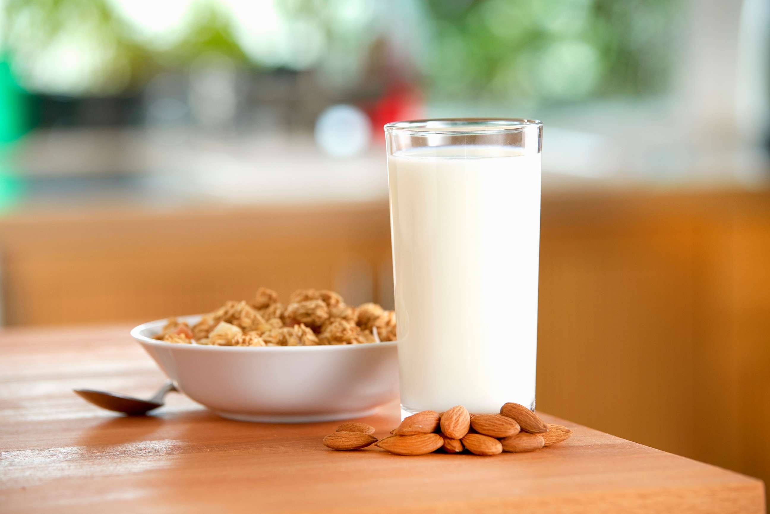 PHOTO: A glass of almond milk, almonds and cereals on a table, in this undated photo.