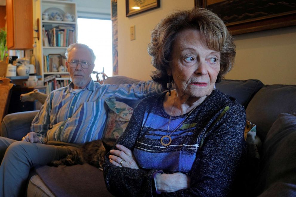 PHOTO: Cynthia Flagg sits with her husband Charles, who took part in an early stage trial of Biogen's drug aducanumab following his diagnosis with Alzheimer's disease, at their home in Jamestown, R.I., Feb. 21, 2020.