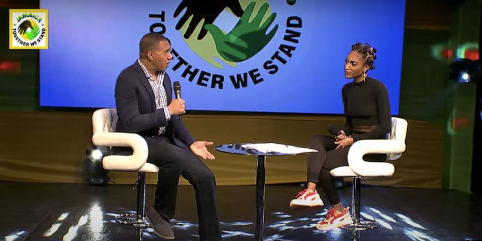 PHOTO: Jamaican Prime Minister Andrew Holness (left) speaks during the "Together We Stand" telethon in Jamaica on April 12, 2020.