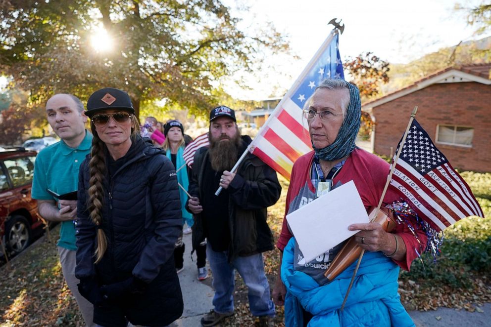 PHOTO: Anti-mask protestors march to the home of Utah Epidemiologist Dr. Angela Dunn, Oct. 29, 2020, in Salt Lake City, Utah.