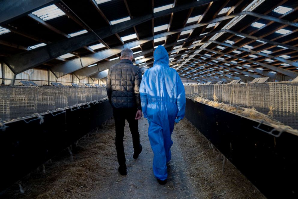 PHOTO: Denmark's Prime Minister Mette Frederiksen and mink breeder Peter Hindbo visit the closed and empty farm near Kolding, Denmark, on Nov. 26, 2020.