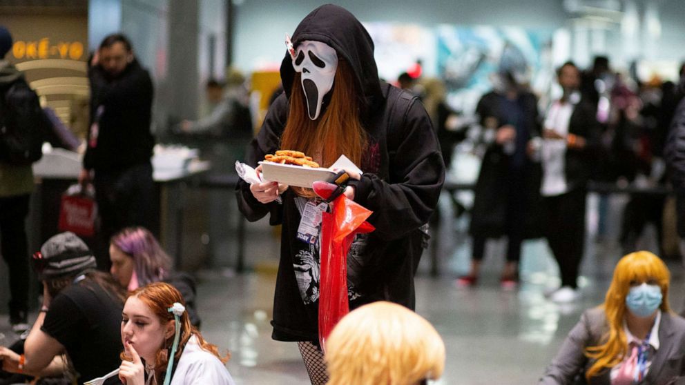 PHOTO: Costumed attendees take a break during Anime NYC at the Jacob K. Javits Convention Center in New York City on Nov. 20, 2021.