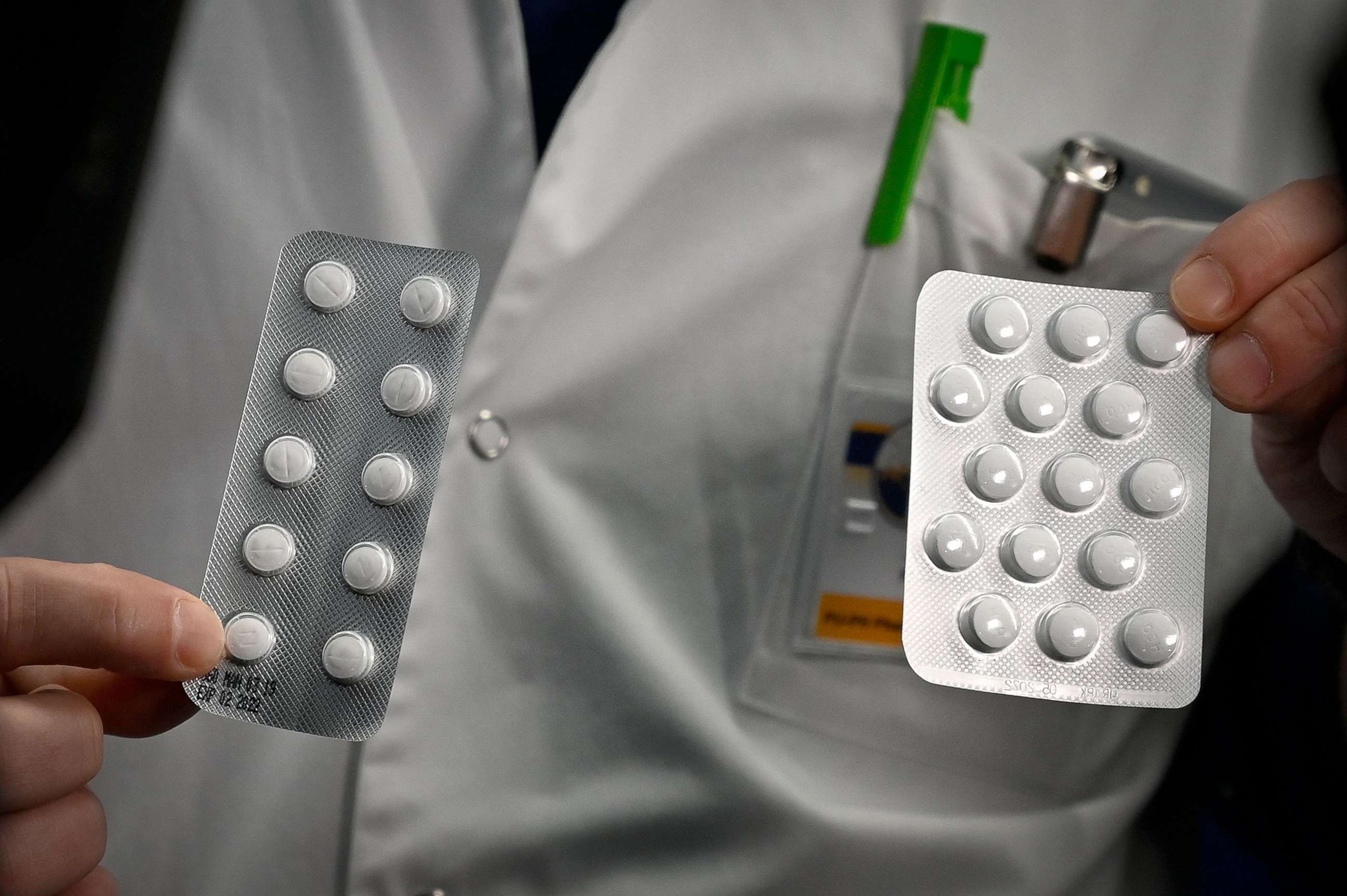 PHOTO: In this file photo taken on Feb. 26, 2020, medical staff at the IHU Mediterranee Infection Institute in Marseille, France, show packets of tablets containing chloroquine and and hydroxychloroquine.