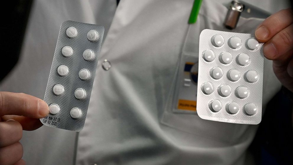 PHOTO: In this file photo taken on Feb. 26, 2020, medical staff at the IHU Mediterranee Infection Institute in Marseille, France, show packets of tablets containing chloroquine and and hydroxychloroquine.