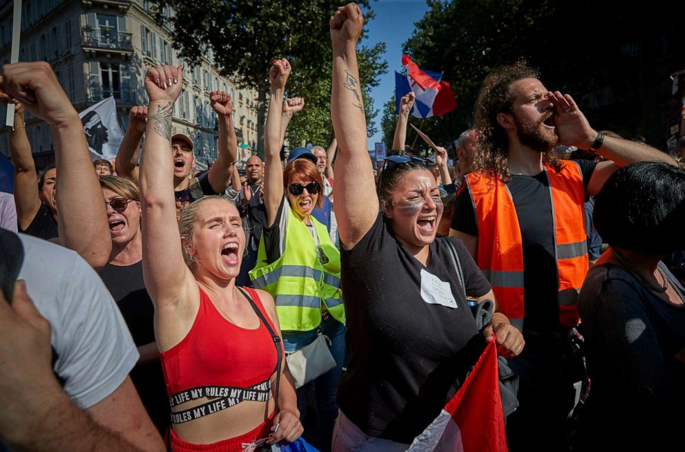 PHOTO: Anti-Vaccine demonstrators chant through the streets of Paris in protest to new restrictions announced by French President Emmanuel Macron on Monday claiming the new measures are against civil liberties, July 17, 2021, in Paris.