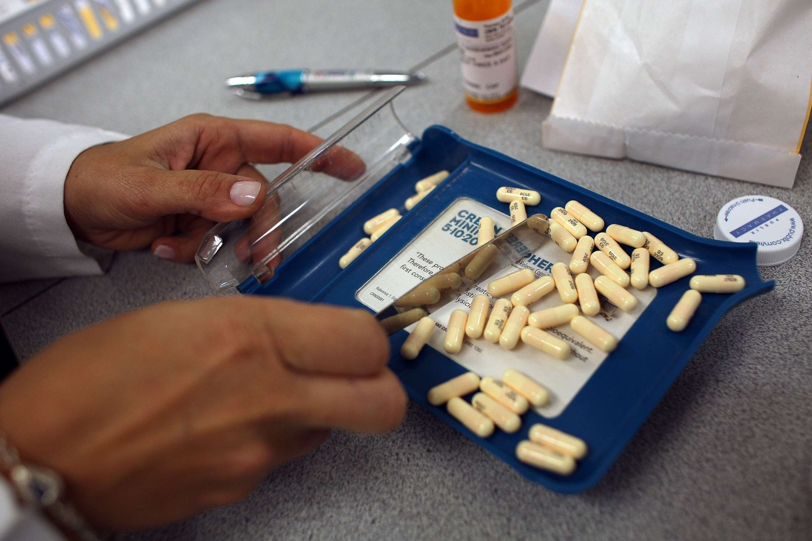 PHOTO: A pharmacy manager counts out the correct number of antibiotic pills to fill a prescription, Aug. 7, 2007 in Miami.