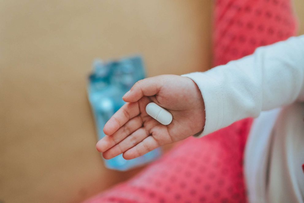 PHOTO: A child holds a pill in this undated stock photo.