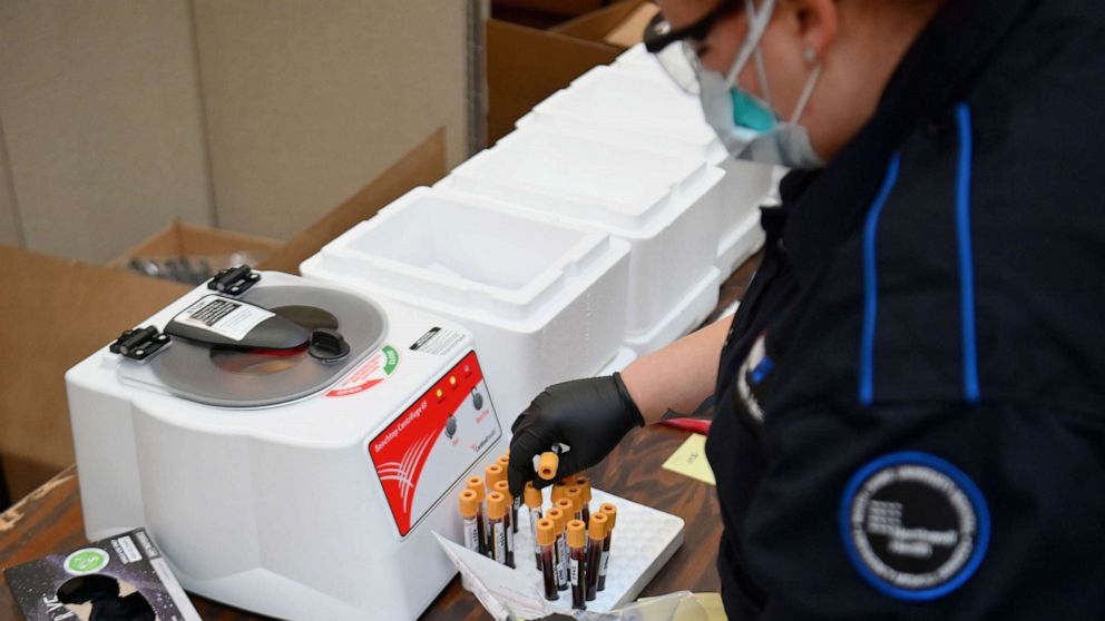 PHOTO: An Emergency medical Technician (EMT) sorts through blood samples to test for COVID-19 antibodies at Abyssinian Baptist Church in the Harlem neighborhood of New York, May 14, 2020. 