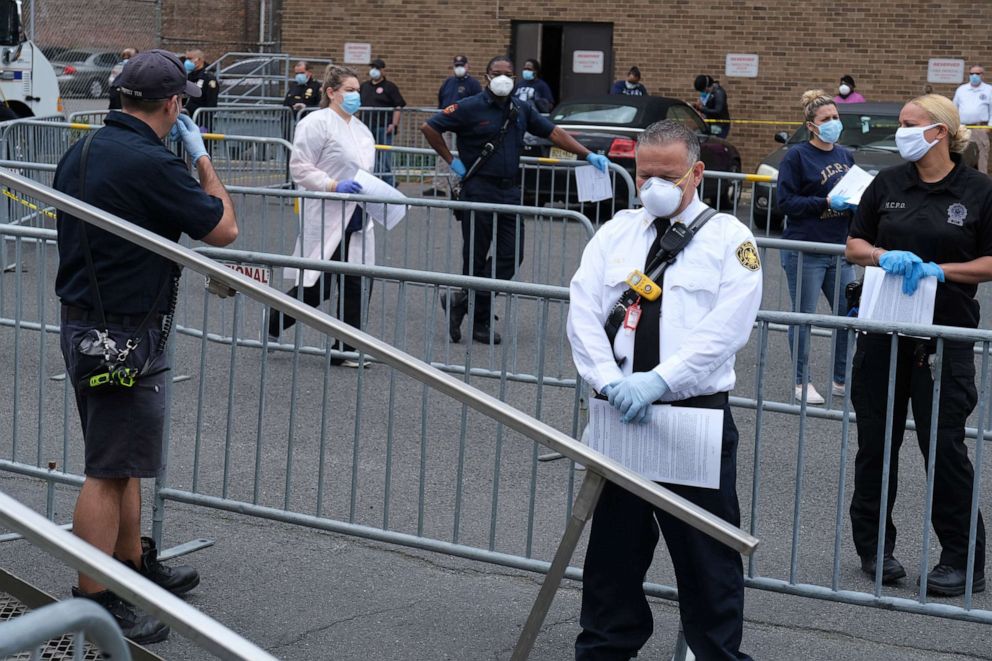 PHOTO: First responders wait in line to be tested for coronavirus antibodies at a testing site in Jersey City, N.J., May 4, 2020.
