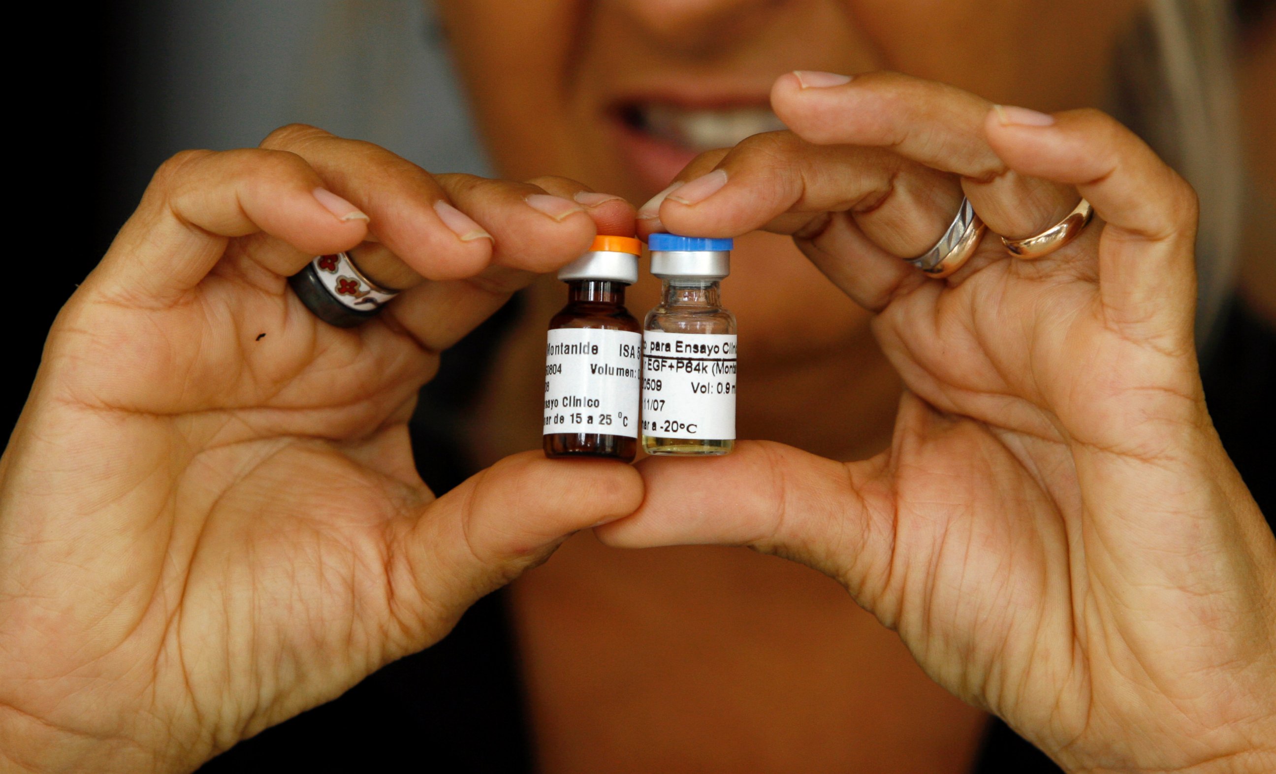 PHOTO: A Cuban health officer presents CimaVax EGF, medicine used in the treatment of advanced lung cancer, in Havana, June 24, 2008.