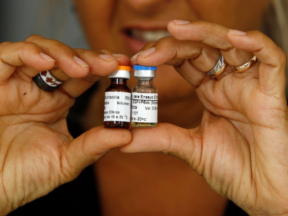 PHOTO: A Cuban health officer presents CimaVax EGF, medicine used in the treatment of advanced lung cancer, in Havana, June 24, 2008.