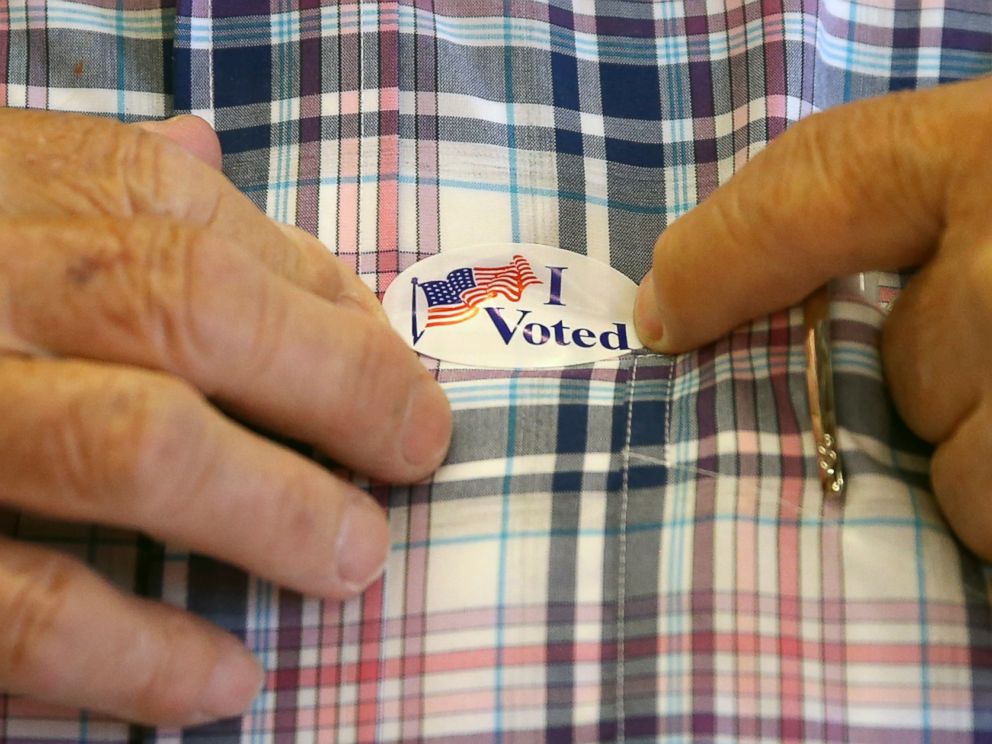 PHOTO: A man puts on a sticker after voting inside Brookside Engine Company 1 firehouse June 7, 2016, in Mendham Township, N.J.