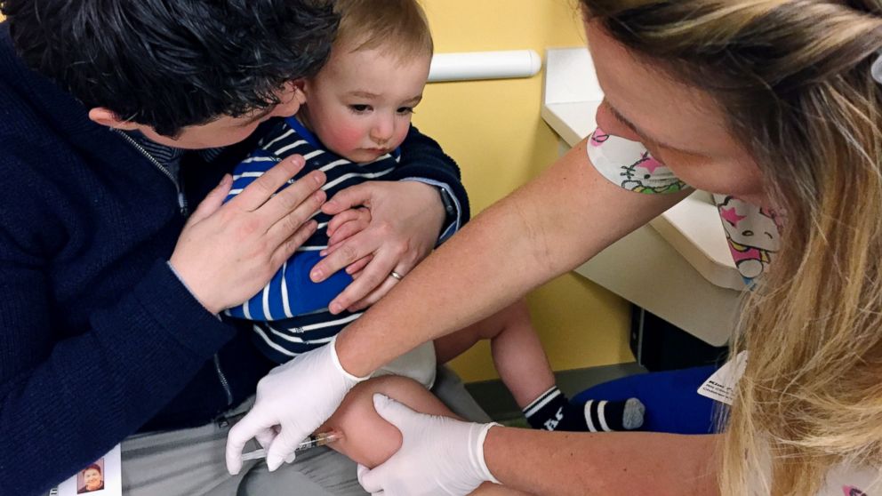 PHOTO: 15-month-old August Goepferd receives the measles, mumps and rubella booster shot at a clinic at Children's Minnesota in Minneapolis, May 2, 2017. 