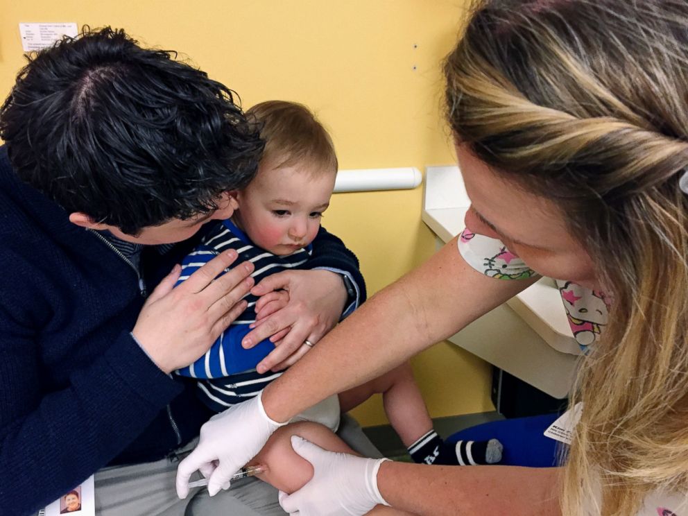 PHOTO: 15-month-old August Goepferd receives the measles, mumps and rubella booster shot at a clinic at Children's Minnesota in Minneapolis, May 2, 2017. 