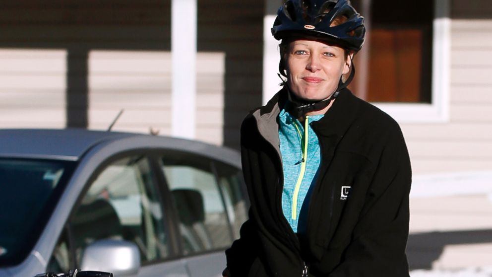 Nurse Kaci Hickox leaves her home on a rural road in Fort Kent, Maine, to take a bike ride with her boyfriend Ted Wilbur, Oct. 30, 2014.