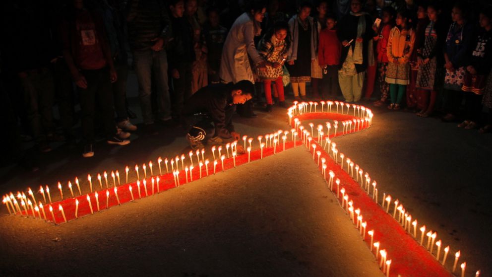Nepalese women and children from ?Maiti Nepal?, a rehabilitation center for victims of sex trafficking, light candles on the eve of World AIDS Day in Kathmandu, Nepal, Nov. 30, 2015. 