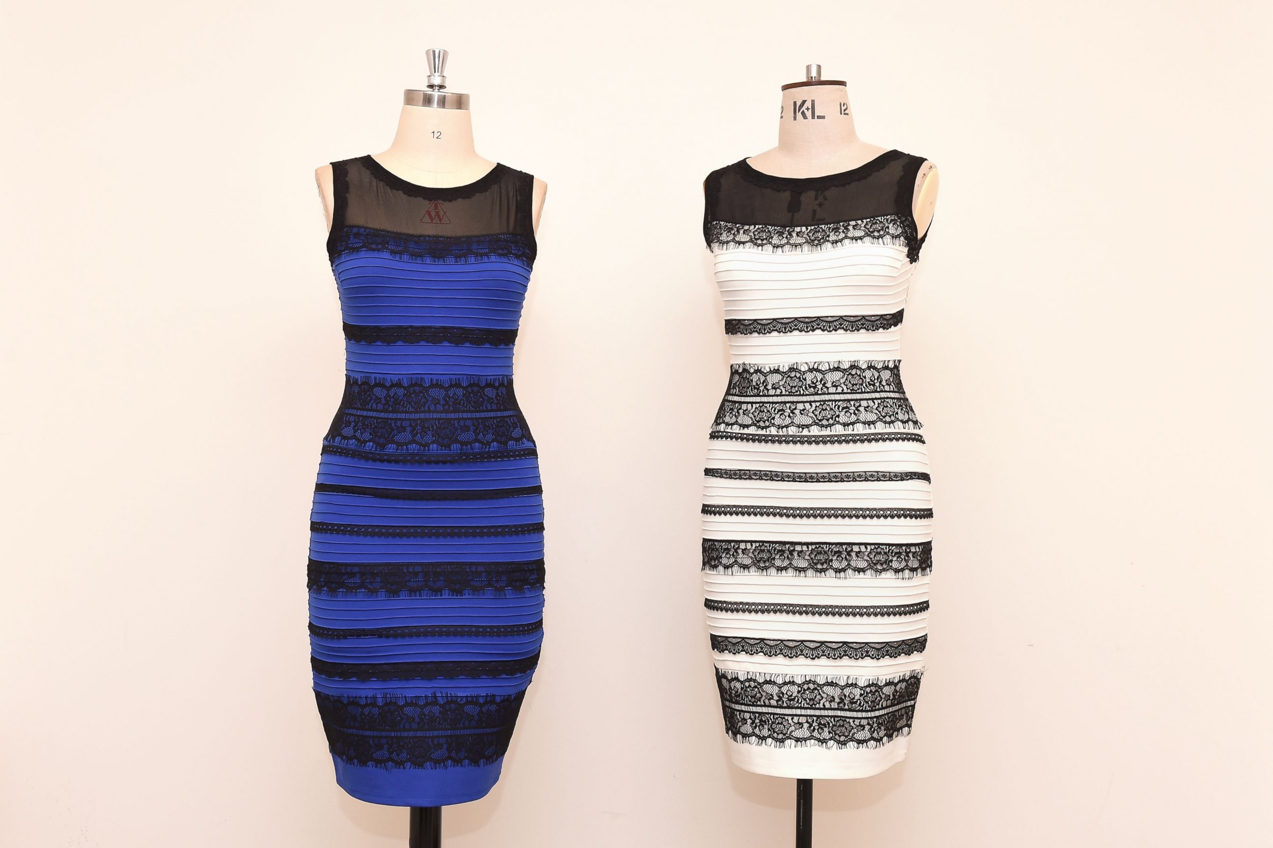 PHOTO: The two-tone dress, left,  alongside an ivory and black version, made by Roman Originals, that has sparked a global debate on Twitter over what color it is on display in Birmingham, England on Feb. 27, 2015.