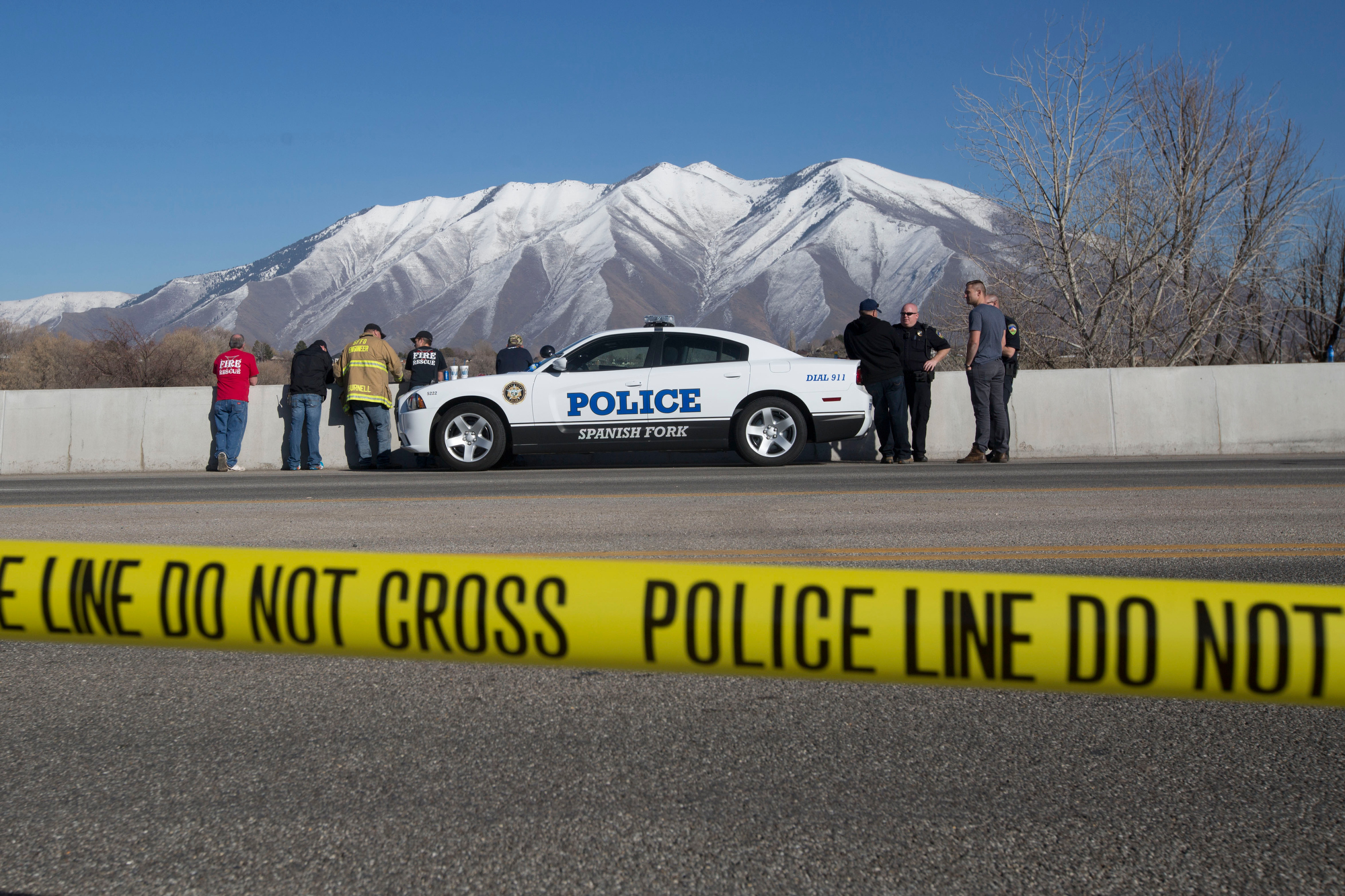 PHOTO: In this March 7, 2015 photo, officials respond to a report of car in the Spanish Fork River in Spanish Fork, Utah. An 18-month-old girl survived.