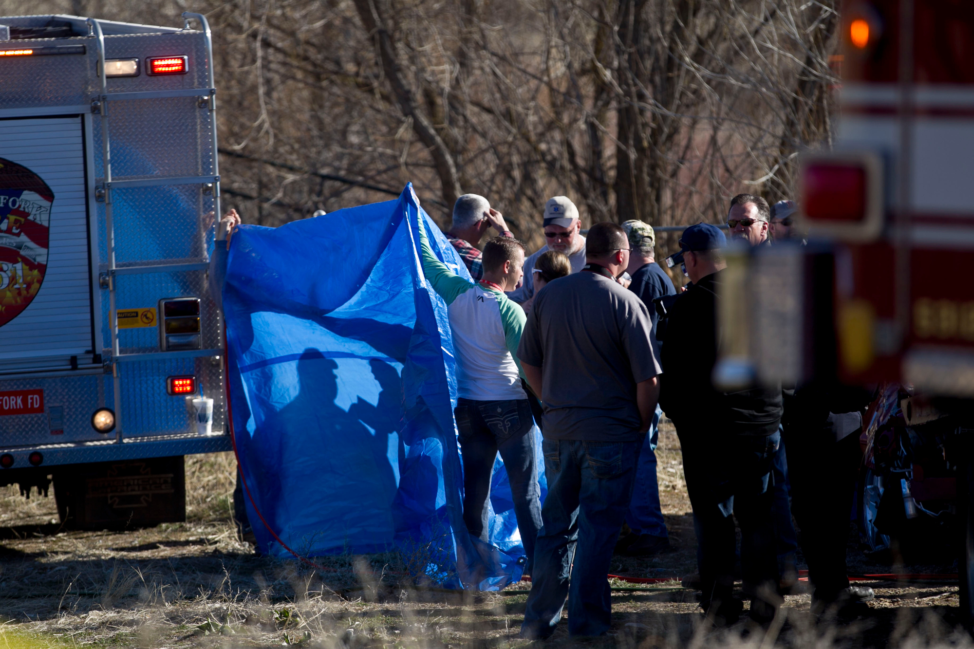 PHOTO: In this March 7, 2015 photo, officials respond to a report of car in the Spanish Fork River in Spanish Fork, Utah.