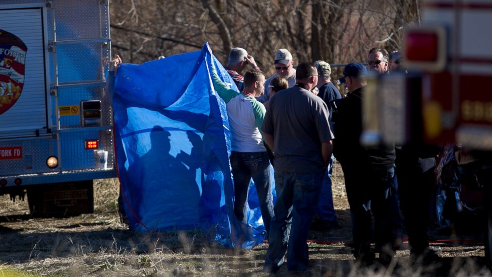 PHOTO: In this March 7, 2015 photo, officials respond to a report of car in the Spanish Fork River in Spanish Fork, Utah.
