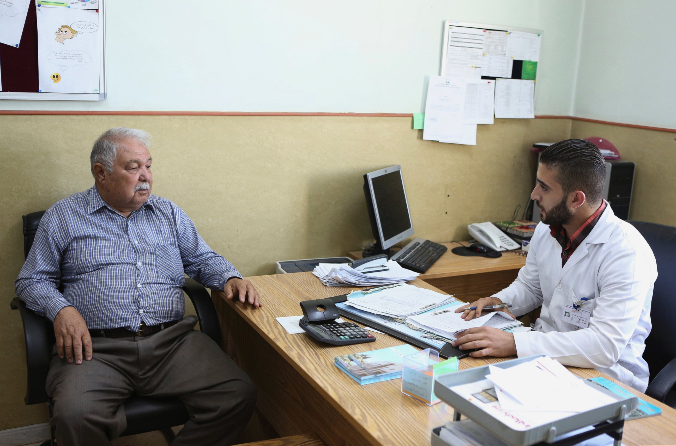 PHOTO: Shawkat al-Khalili, a 70-year-old diabetic, is examined by Dr. Nayef Khalayla at Jordan's National Center for Diabetes in Amman, Jordan on June 14, 2015.