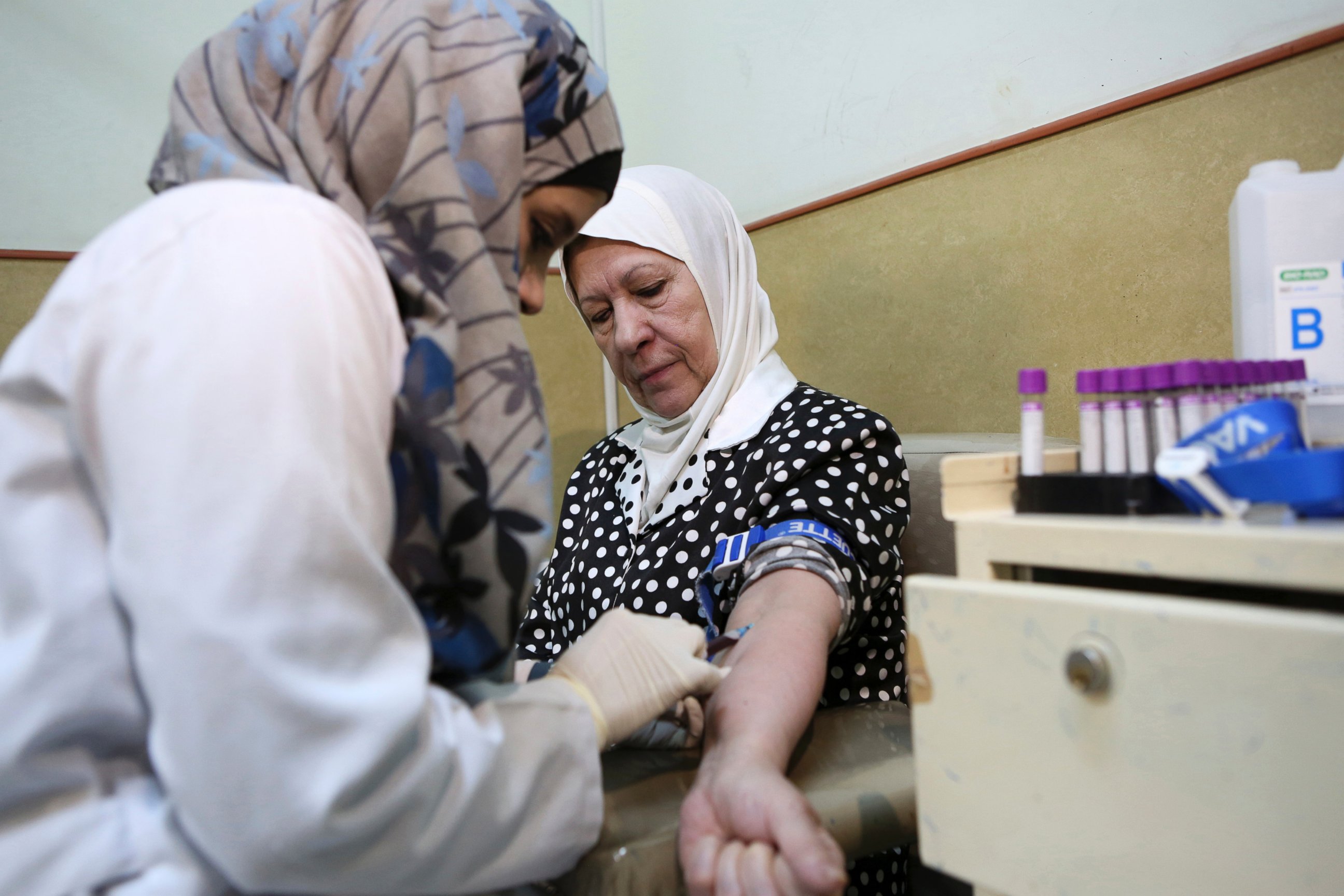PHOTO: A nurse takes blood from a patient at Jordan's National Center for Diabetes in Amman, Jordan, June 14, 2015.