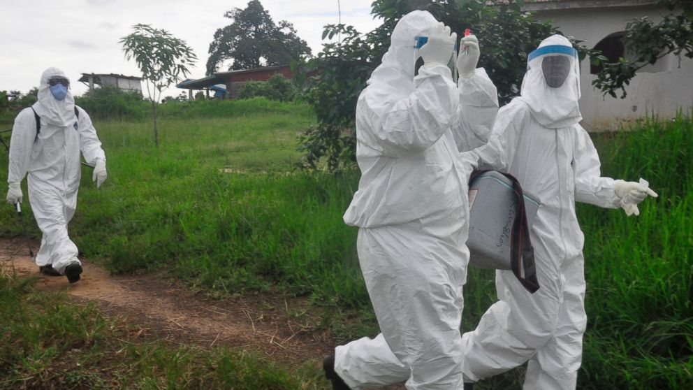 PHOTO: Health workers leave after they took blood from a child to test for the Ebola virus in a area were a 17-year old boy died from the virus on the outskirts of Monrovia, Liberia, June 30, 2015.