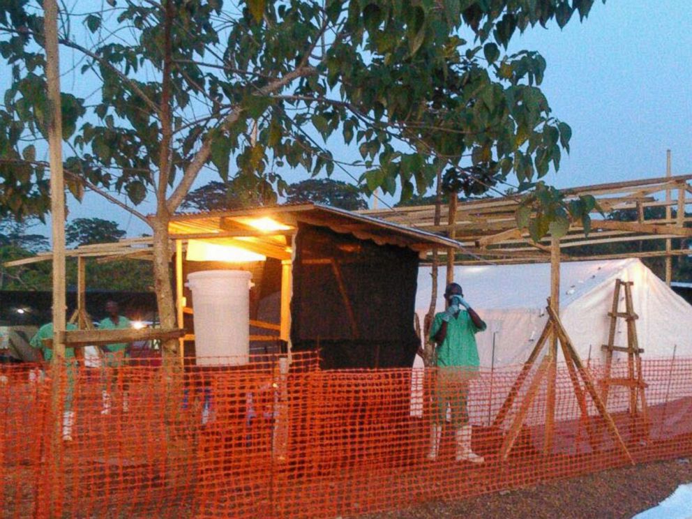 PHOTO: In this July 27, 2014 photo, medical personnel work at the Doctors Without Borders facility in Kailahun, Sierra Leone where Dr. Sheik Humarr Khan died.