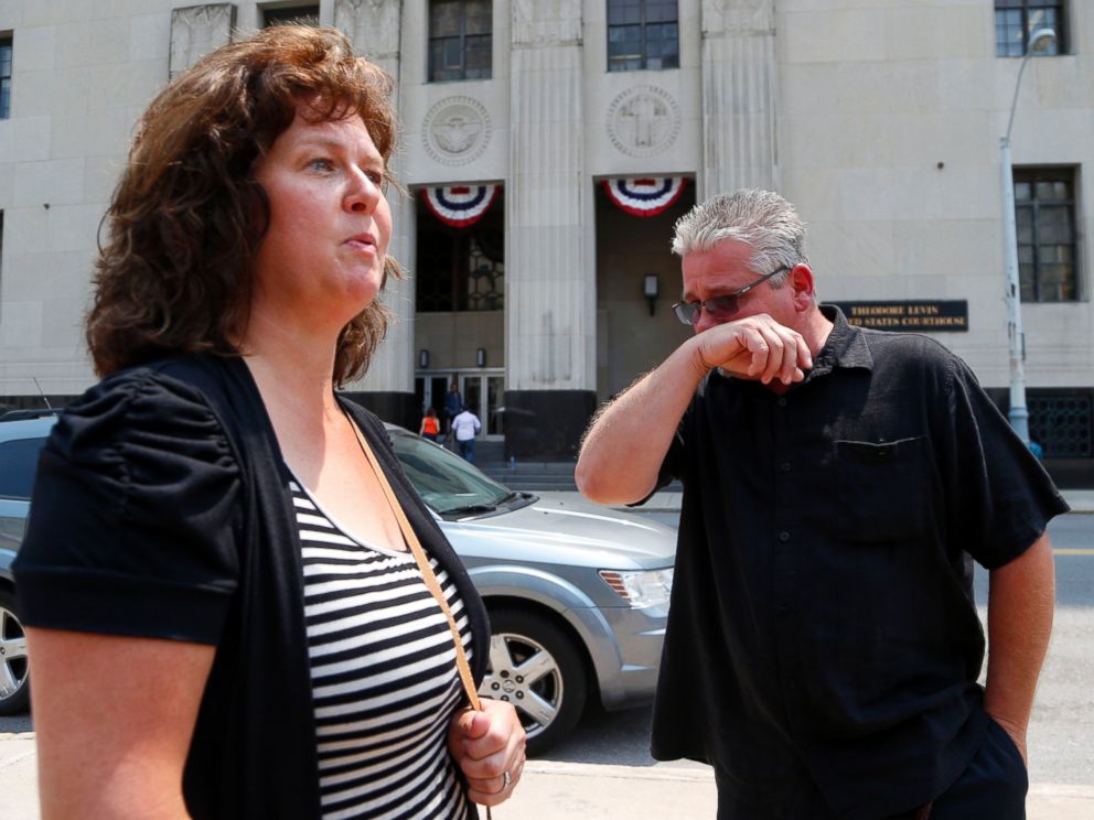 PHOTO: Terry Spurlock, right, of Holly, Mich., a former patient of Dr. Farid Fata, speaks with his wife Nikii outside federal court, July 6, 2015, in Detroit.