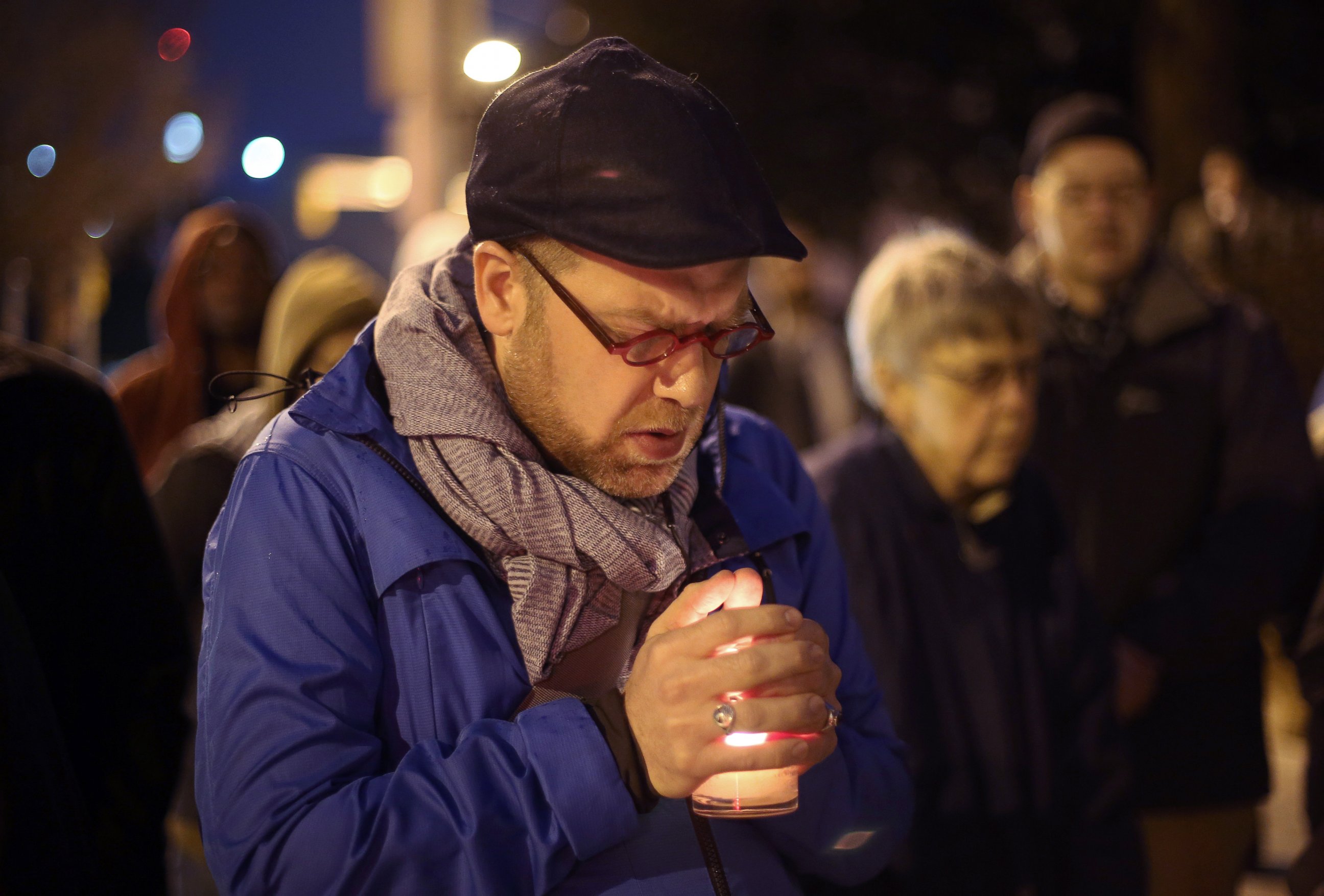 PHOTO: Michael Patter, senior minister at Central Congregational United Church of Christ, prays silently during a vigil for Kelly Gissendaner and protest against the death penalty on March 2, 2015, on the steps of the State Capitol.