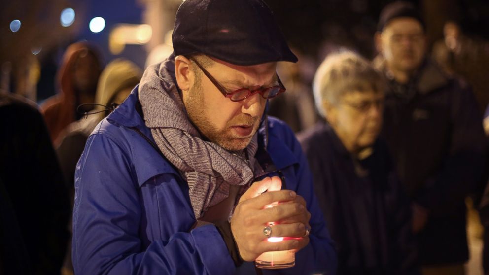 PHOTO: Michael Patter, senior minister at Central Congregational United Church of Christ, prays silently during a vigil for Kelly Gissendaner and protest against the death penalty on March 2, 2015, on the steps of the State Capitol.