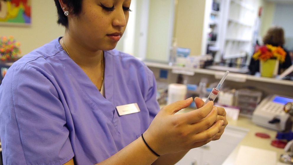 Natasha Munoz prepares vaccinations at the Tamalpais Pediatrics clinic, Feb. 6, 2015, in Greenbrae, Calif. 