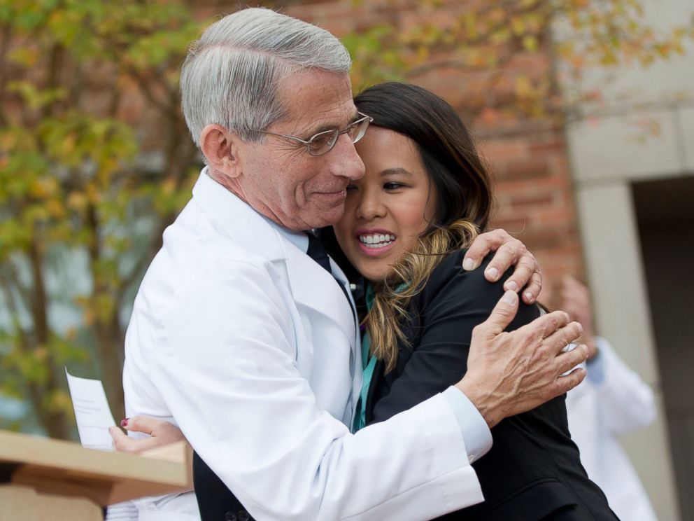 PHOTO: Nina Pham is hugged by Dr. Anthony Fauci, director of the National Institute of Allergy and Infectious Diseases, outside NIH in Bethesda, Md., Oct. 24, 2014.