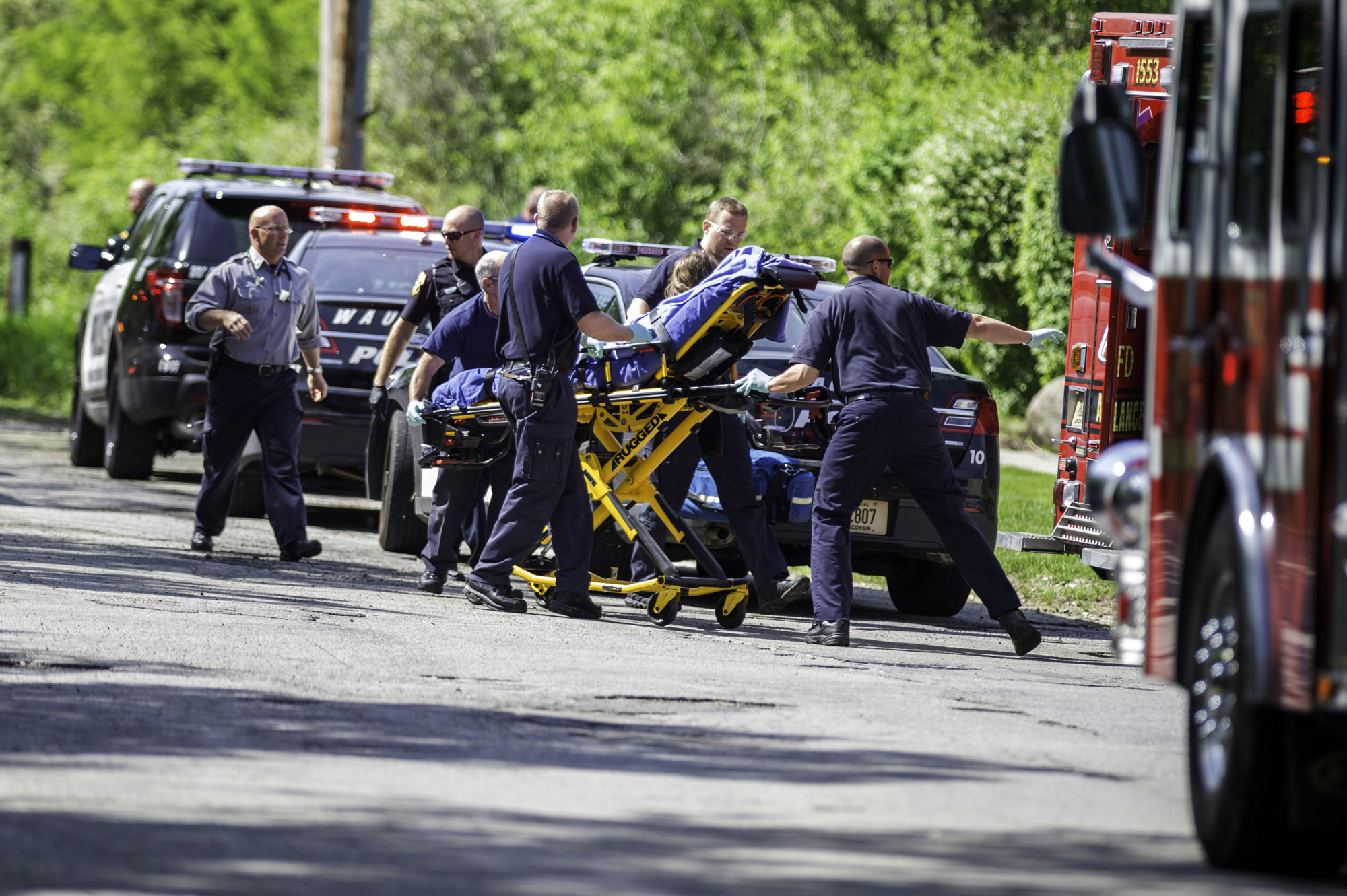 PHOTO: Rescue workers take a 12-year-old stabbing victim to an ambulance in Waukesha, Wis. after she was attacked by two 12-year-old-friends who claim they were inspired by a story they read online.